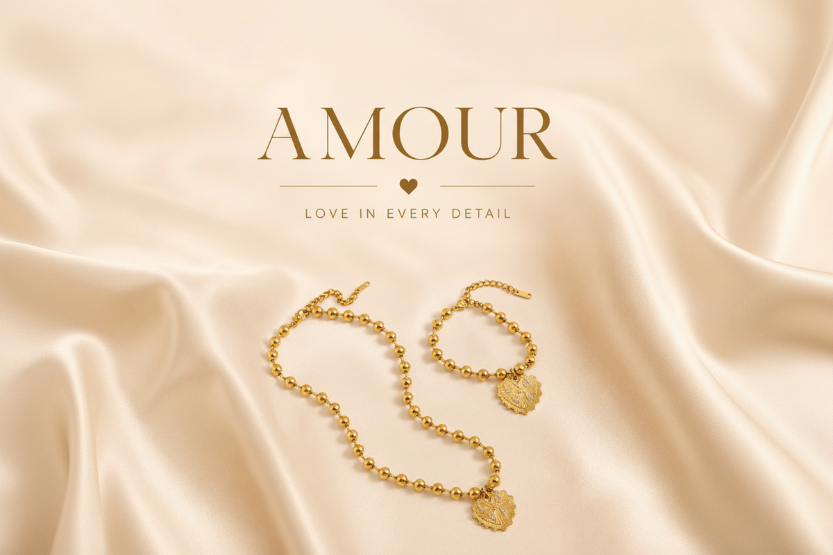 Amour collection hero banner - gold necklace and bracelet on silk